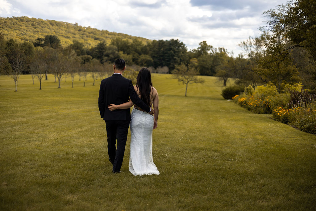 bride and groom in field nj wedding